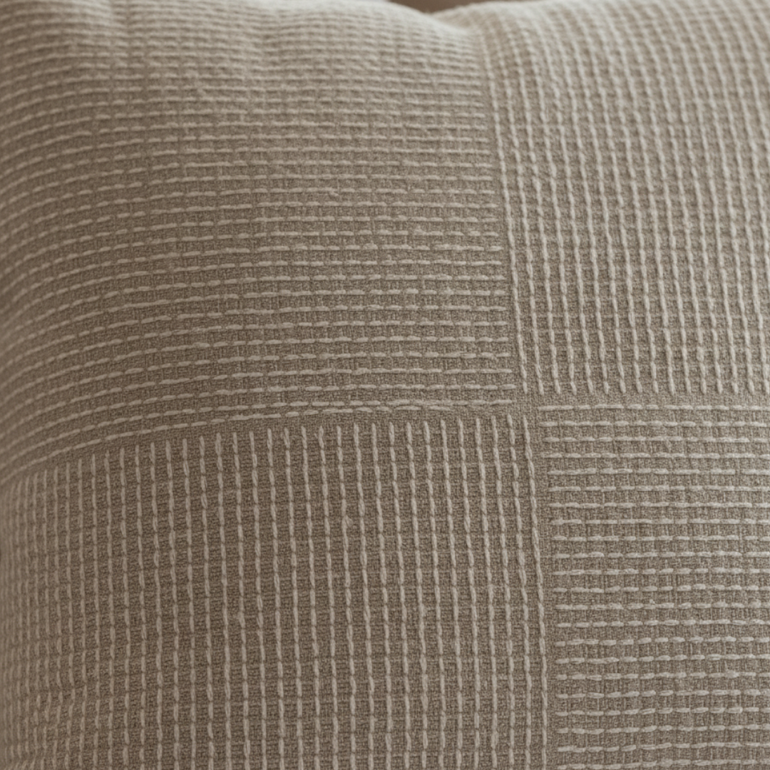 Close-up of a textured brown fabric surface