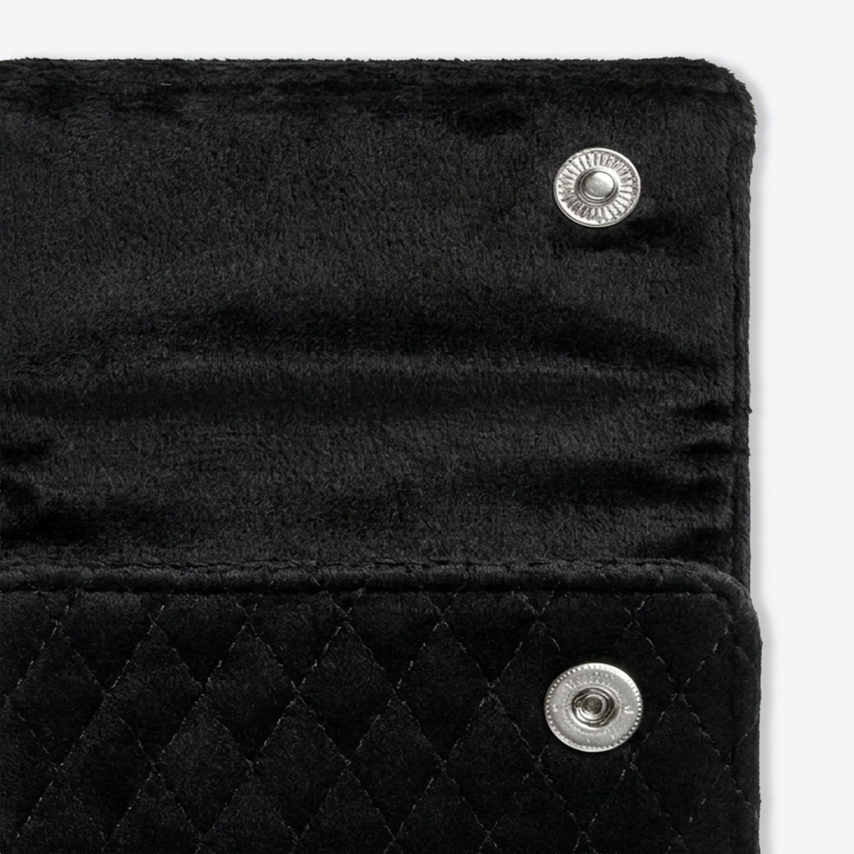 Quilted velvet chain wrap opened flat, showing the padded lining and fold-over closure