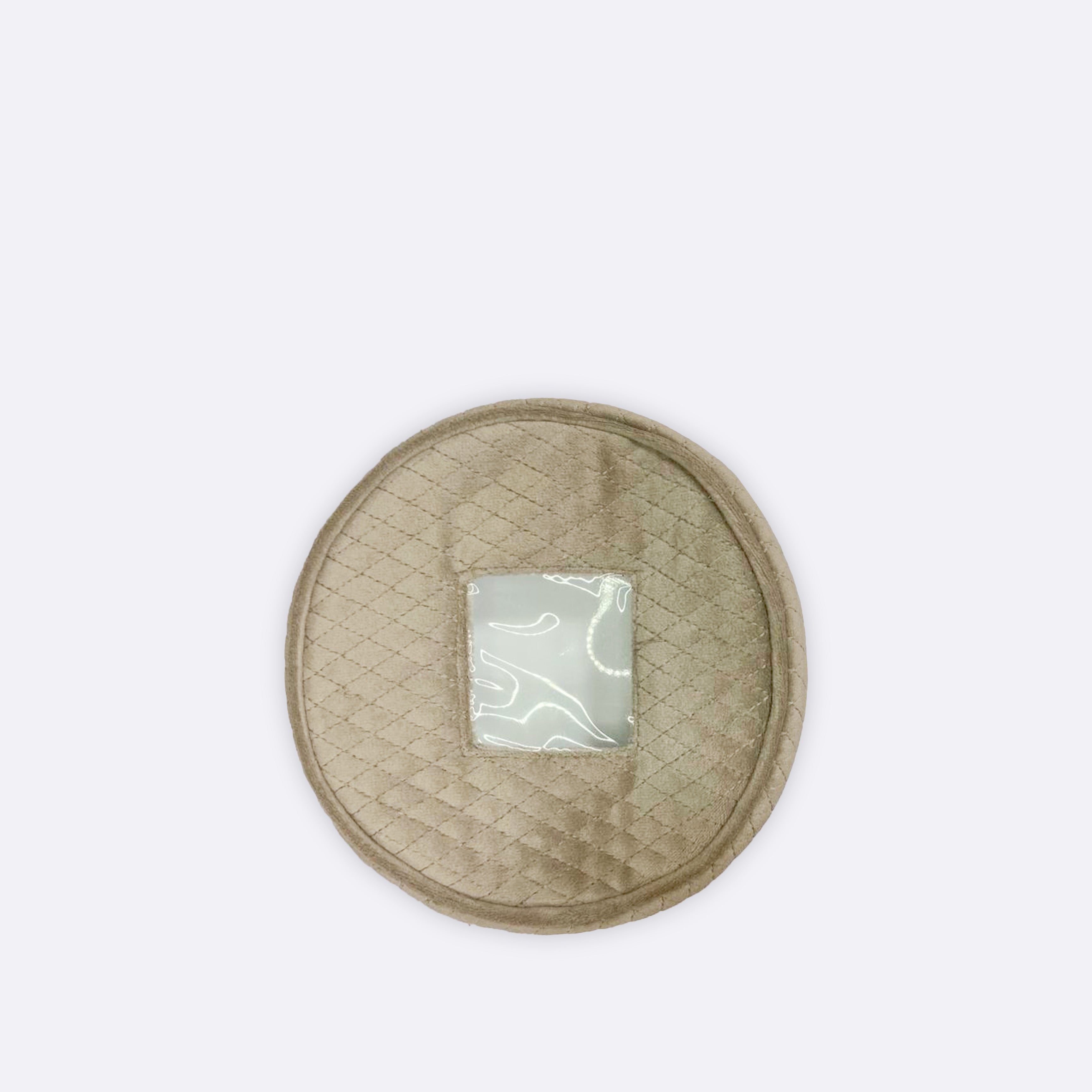 Round beige quilted coaster with a silver emblem on a white background