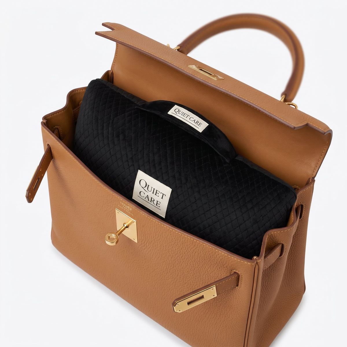 Quilted velvet bag shaper shown inside a tapered top-handle bag, holding the base full