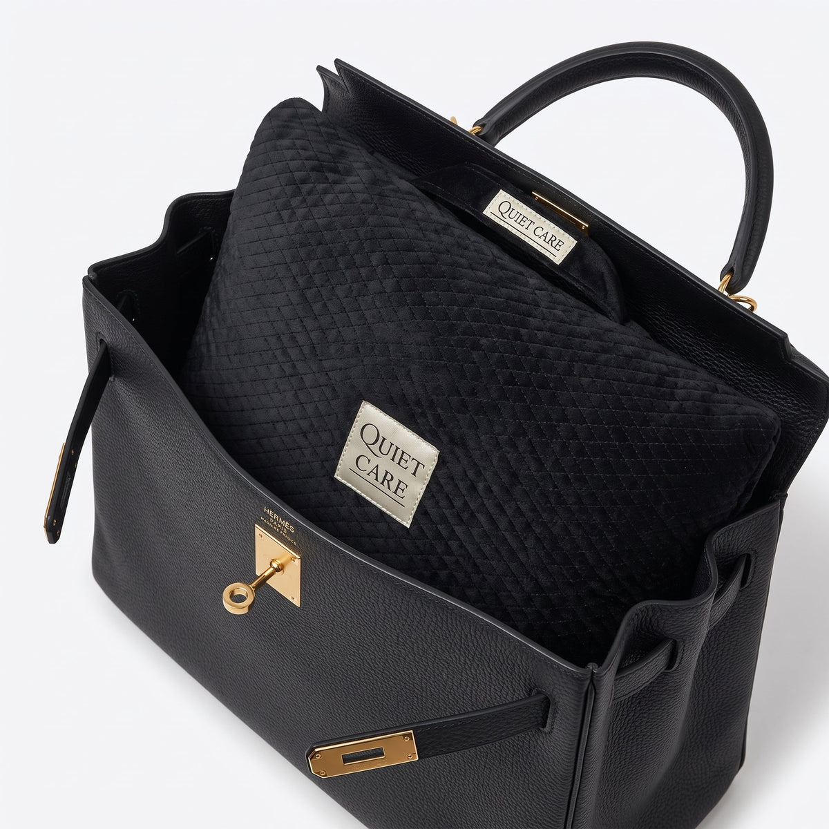 Quilted velvet bag shaper shown inside a large tapered top-handle bag