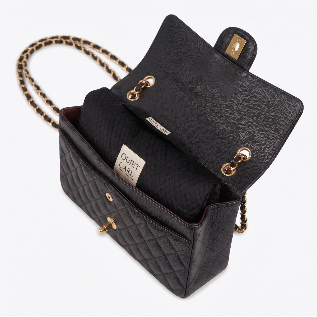 Quilted velvet bag shaper shown inside a large flap shoulder bag