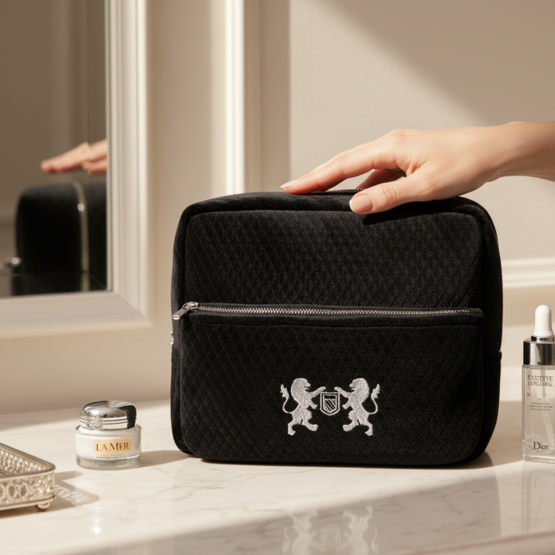 Black toiletry bag with lion emblem on a bathroom counter