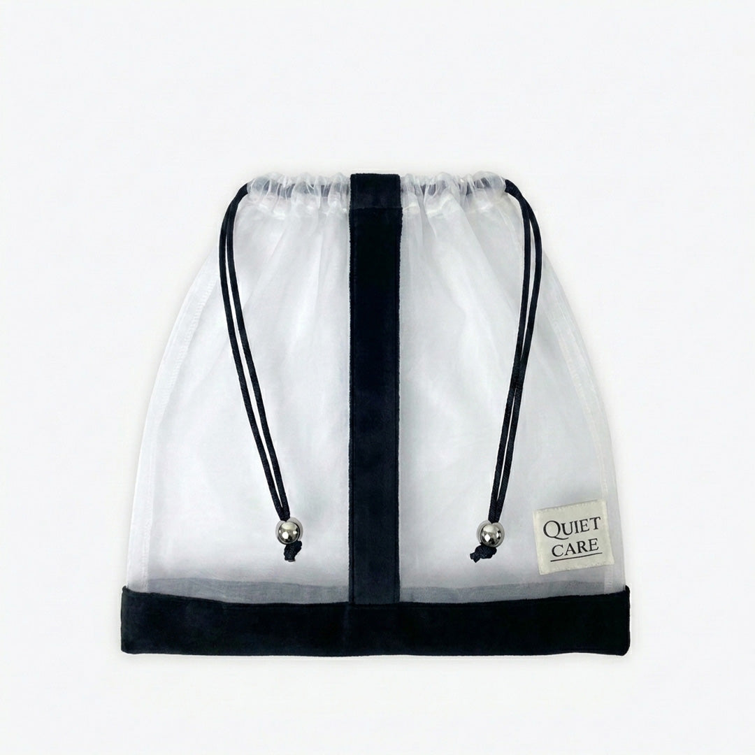 Sheer shoe bag with velvet trim and metal ball pulls, empty
