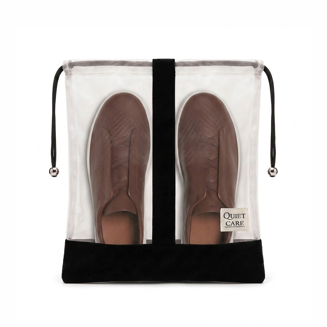 Large sheer shoe bag with velvet trim holding a pair of shoes, centre divider visible