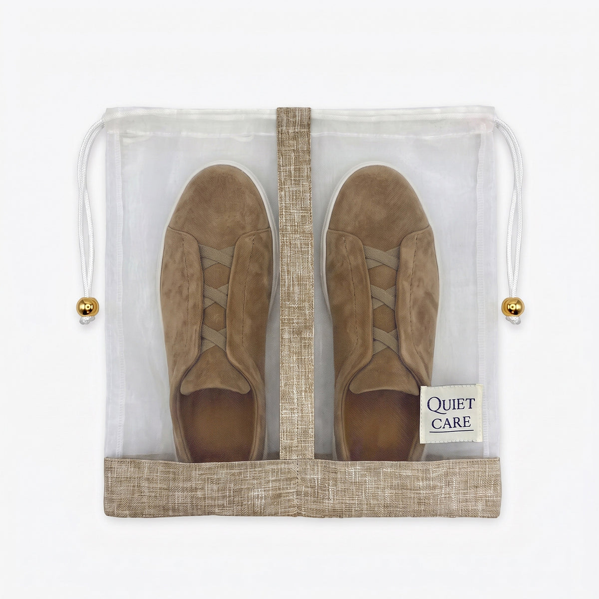 Large sheer shoe bag with linen blend trim holding a pair of shoes, centre divider visible