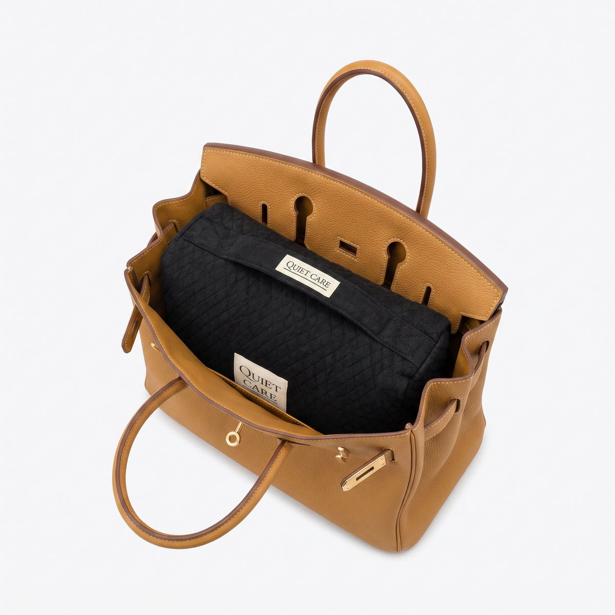 Quilted velvet bag shaper shown inside a structured top-handle tote, holding the sides open
