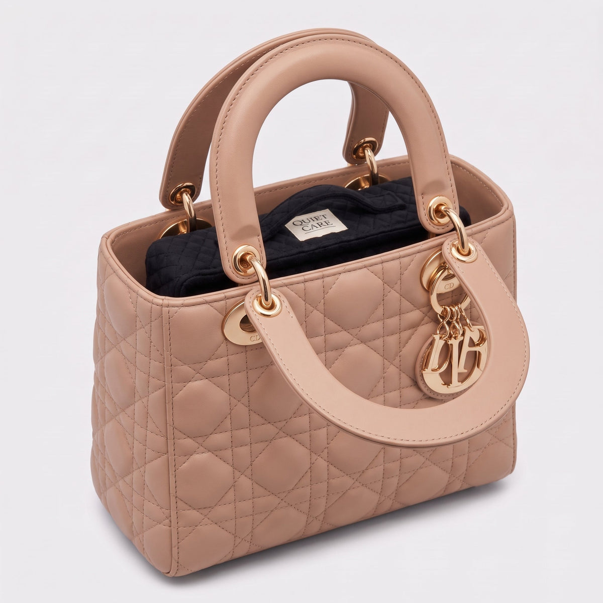Quilted velvet bag shaper shown inside a compact structured bag, holding the corners square