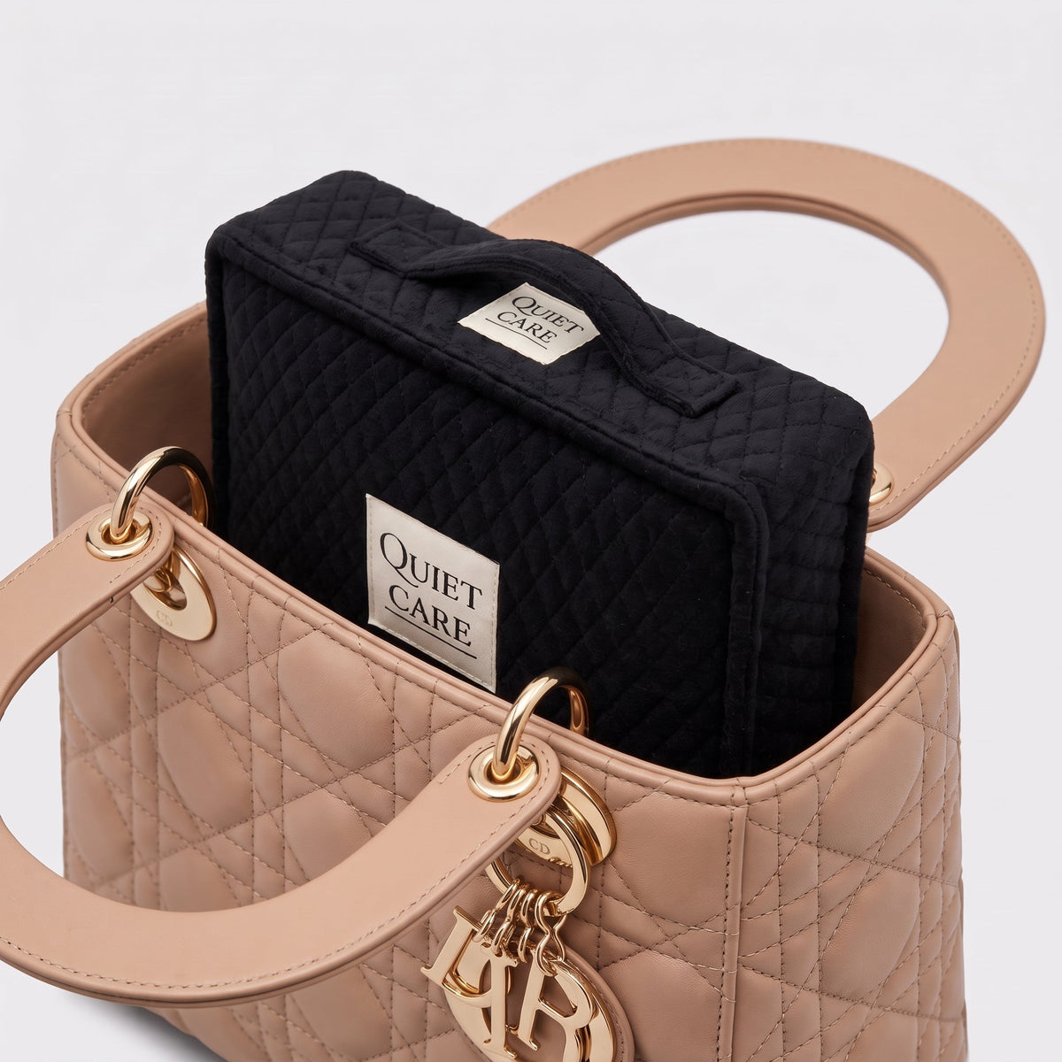 Quilted velvet bag shaper inside a compact structured bag, second angle
