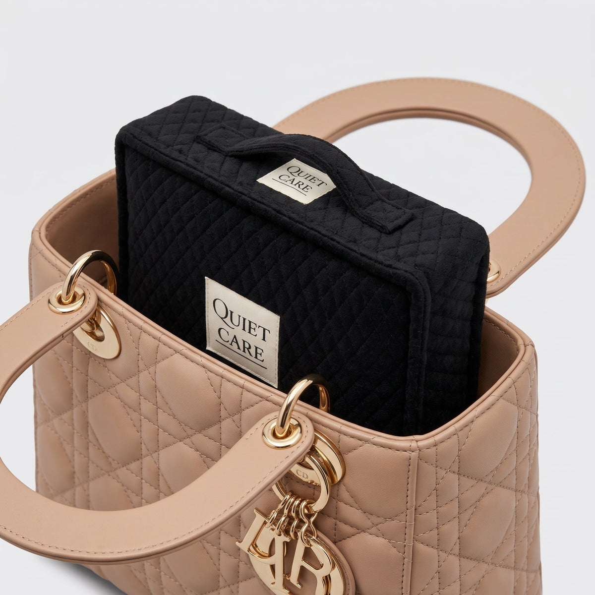 Quilted velvet bag shaper inside a compact structured bag, fourth angle