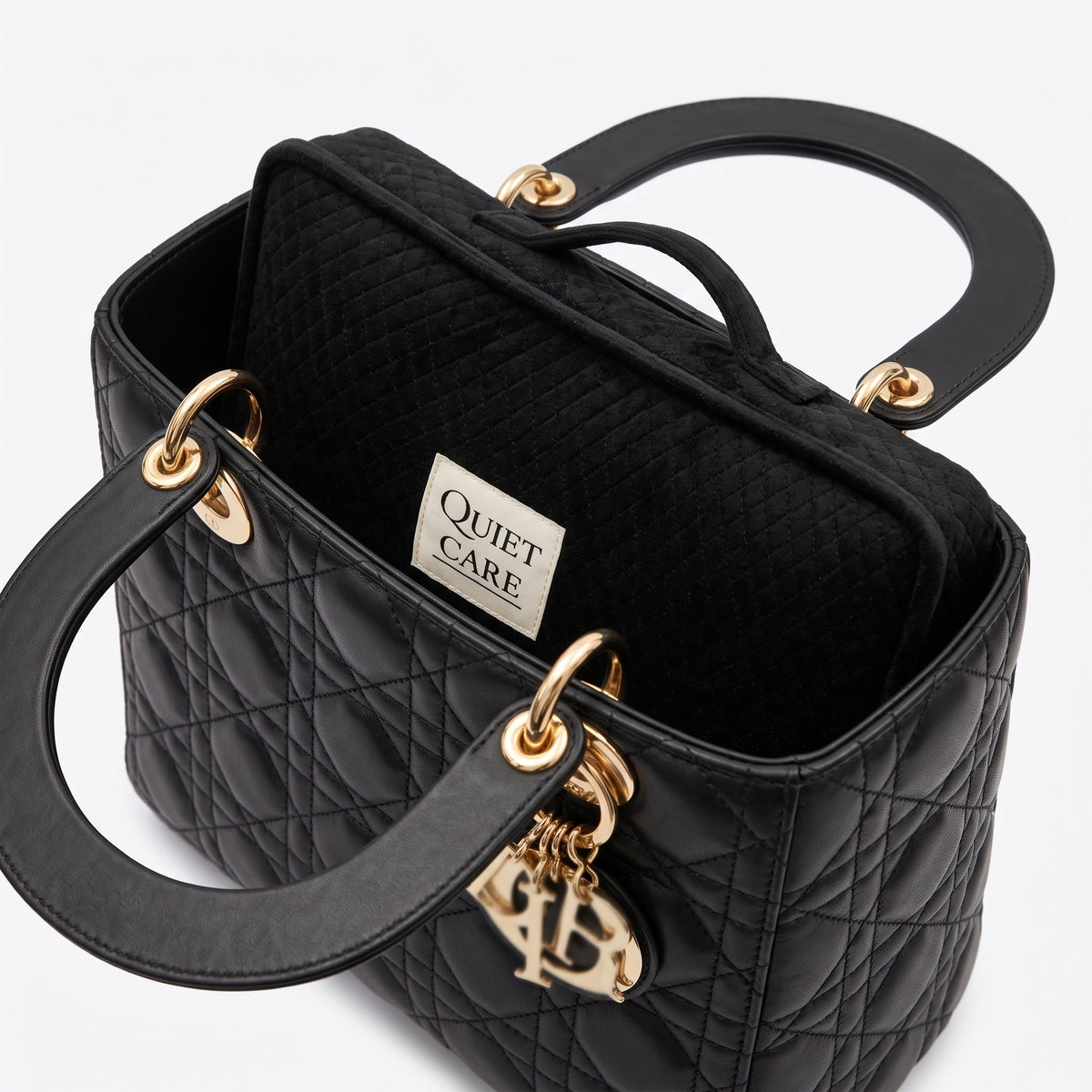 Quilted velvet bag shaper shown inside a compact structured bag, holding the corners square