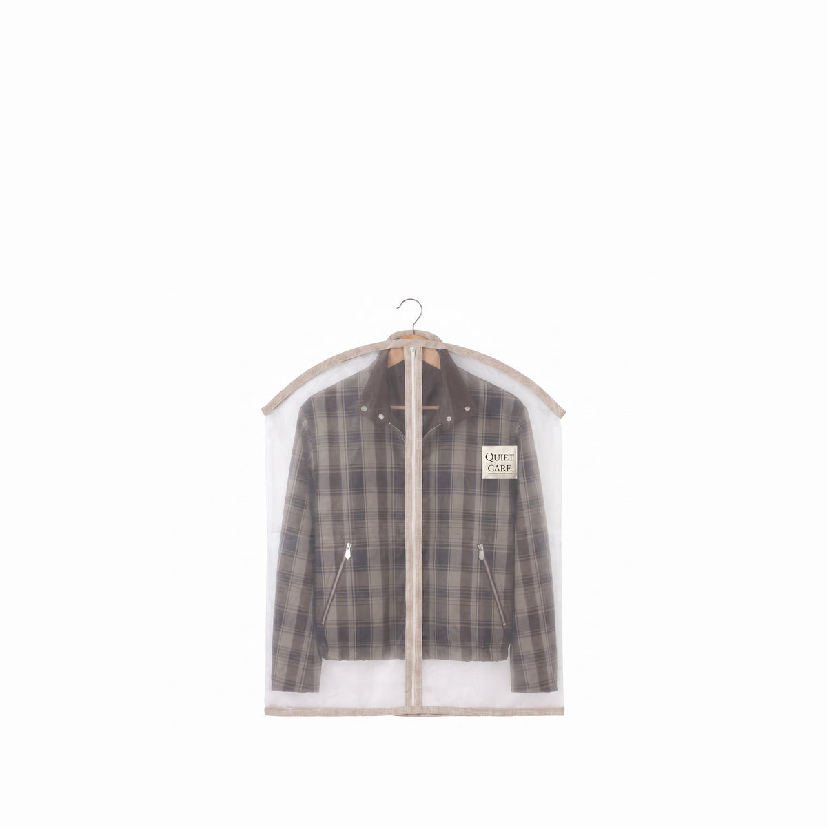 Sheer organza garment cover holding a checked jacket, visible through the fabric