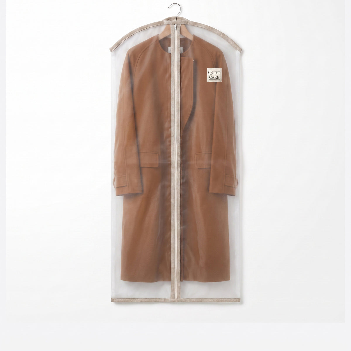 Sheer organza garment cover holding a full-length coat, visible through the fabric